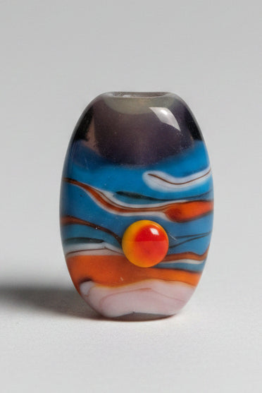 A single oval glass lampwork bead with a colorful swirl pattern of blue, orange, white, and dark gray.